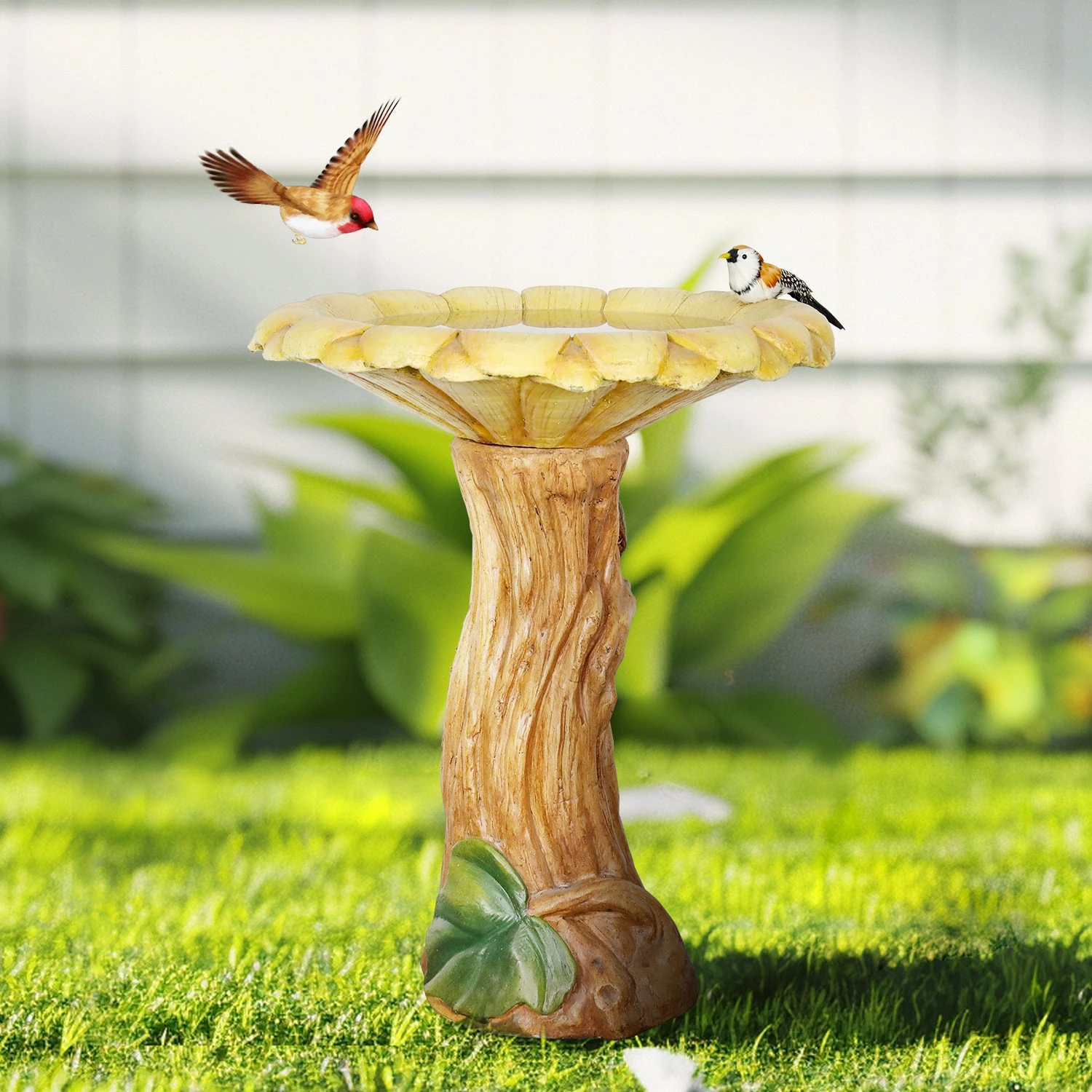 Close-up of a large copper bird bath basin showing textured interior and water droplets
