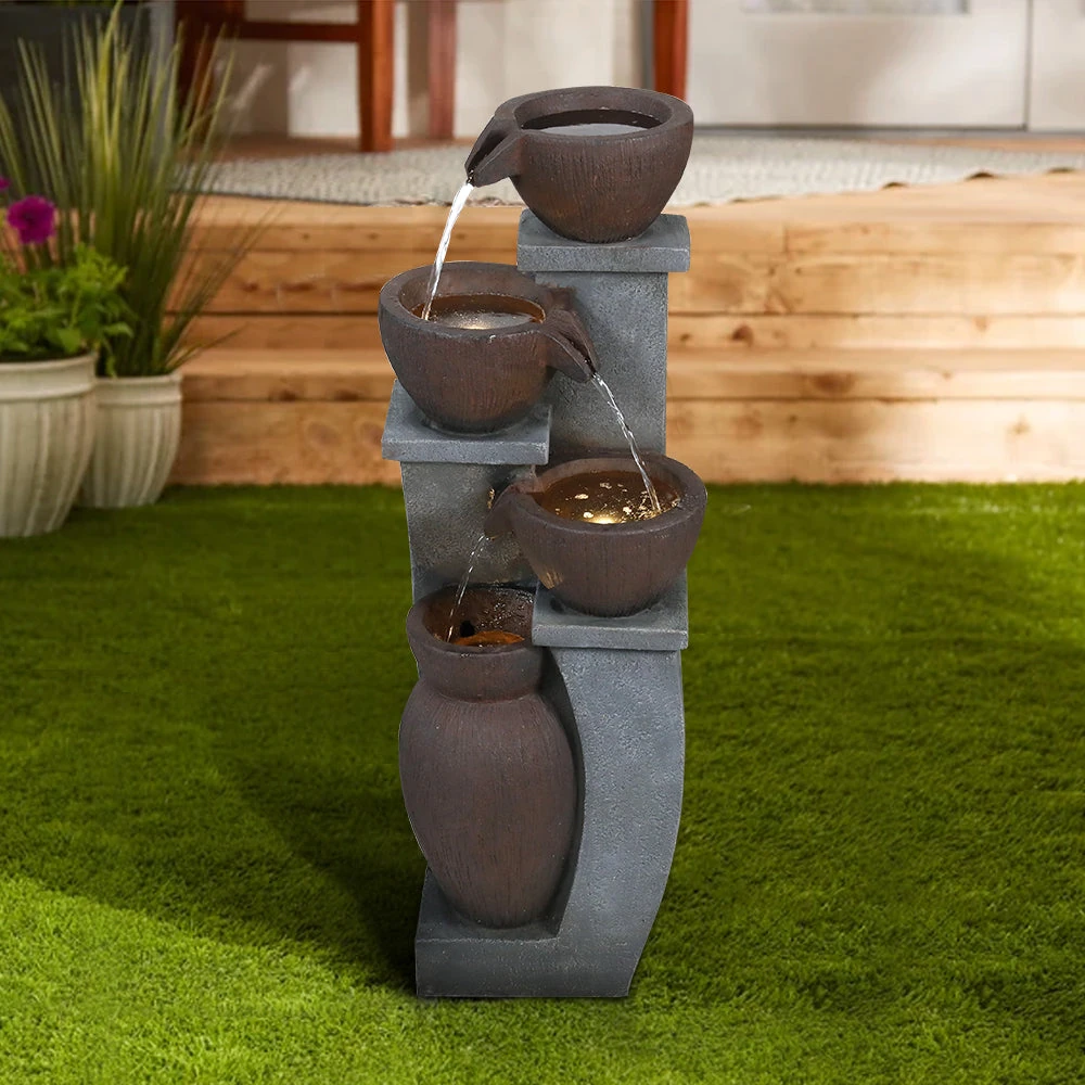 concrete squirrel bird bath - Concrete squirrel bird bath in a Texas garden with birds and squirrels around it