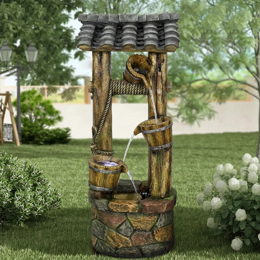 solar bird bath water wiggler in a garden setting with birds gathering around the moving water